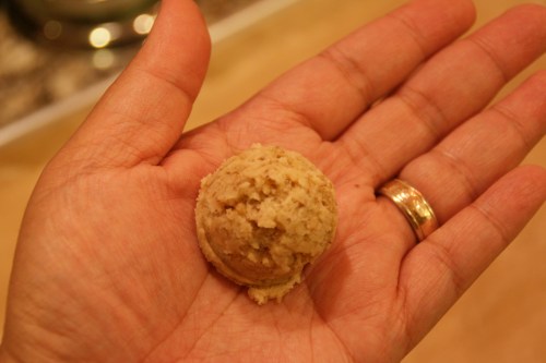 Roll the ball in your hands into a little log.