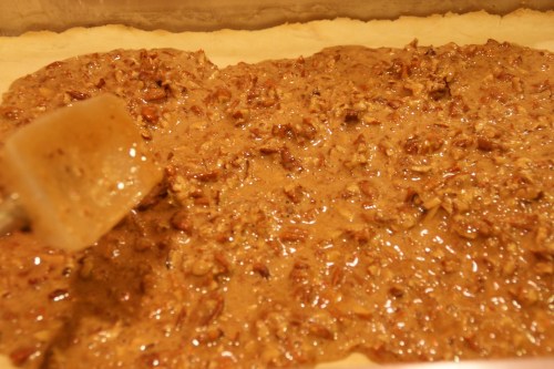 Make sure the topping is evenly distributed over the base; I use a rubber spatula to help.