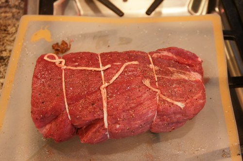 Use kitchen string to tie up the roast