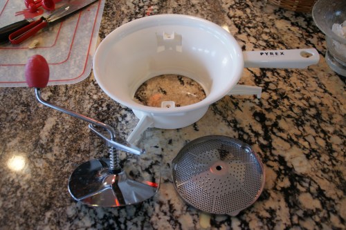 There are three pieces to a food mill- the crank, the bowl and the blade.