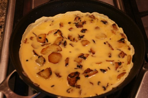 Cook til the eggs are set; you may have to turn down the heat a little if the tortilla is thick