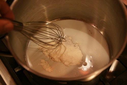 Whisk a little milk at first to get the flour wet and help avoid lumps