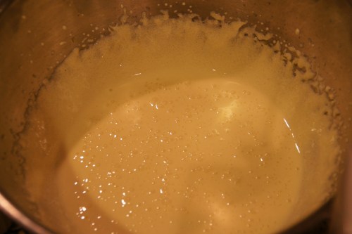 The egg  yolks will thin out slightly after adding the liqueur