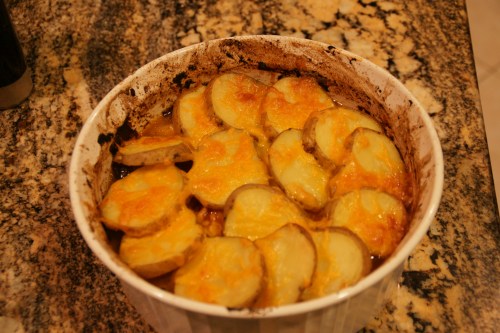 Stew is bubbling and cheese is melted and brown