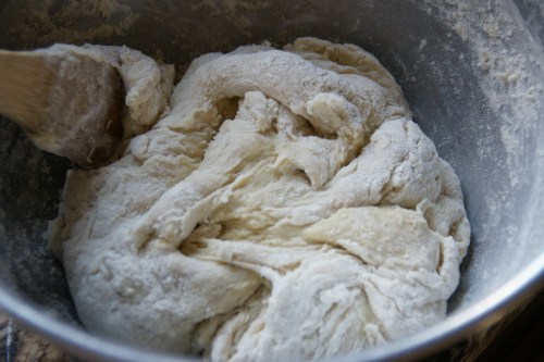 When it's ready, the dough will start to "clean" the flour from the sides of the bowl