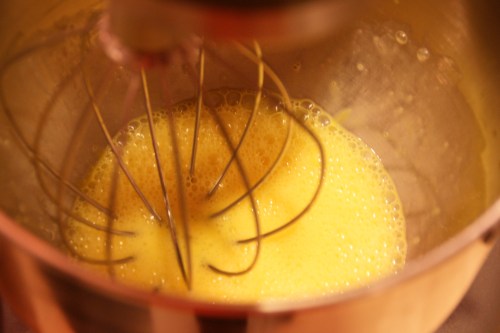 The sugar will dissolve more easily if the eggs are frothy vs. unbeaten.