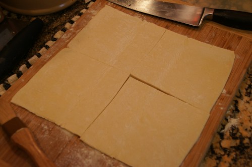 Score the pastry, then press your knife along the guideline-- DON'T drag it across as my son did because it can tear the pastry