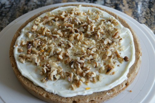 Crunch walnuts and orange-flavored cream cheese frosting