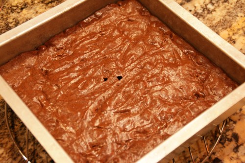 A few crumbs on the cake tester are OK-- I usually don't bother to test.  I just look at the crust to see if it's shiny and firm.