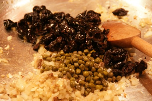 Tangy capers and olives.  Use the oil-cured (wrinkly) kind-- they are less salty than brined ones