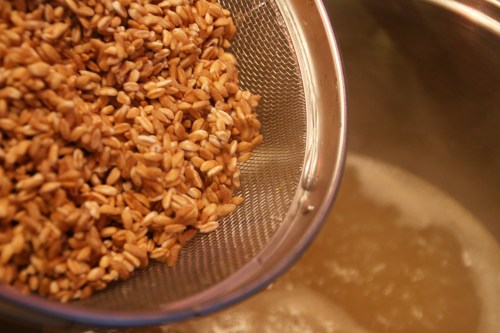 The chicken broth will be almost fully absorbed by the farro!