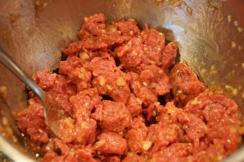 Break up the meat to make it easier to add the rice