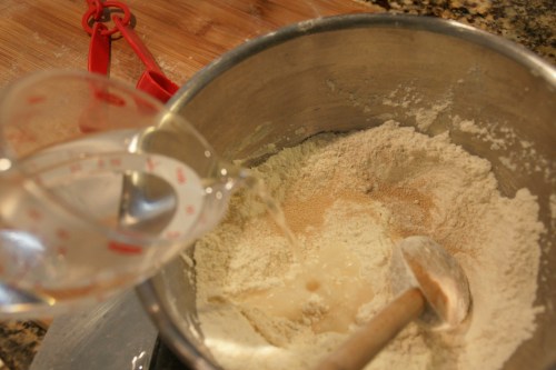 I add a little water over the yeast at first just to get the dough started