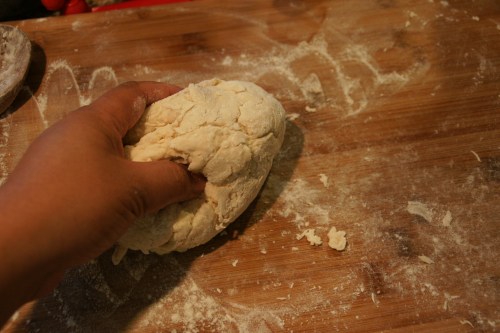 Use your fingertips to pull the dough into a ball