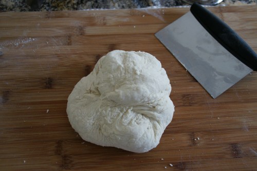 If the dough doesn't stick to the surface, you don't knead to keep flouring!