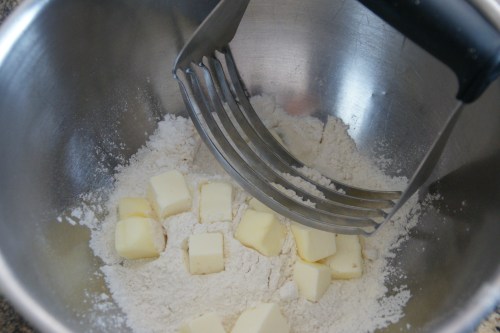 Use a pastry cutter to evenly distribute butter into the flour