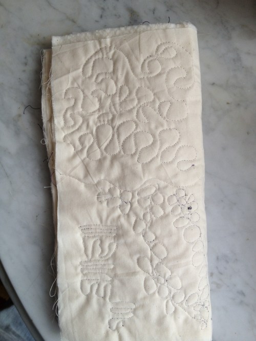 My attempt at free motion quilting (I'm using a stencil next time)...