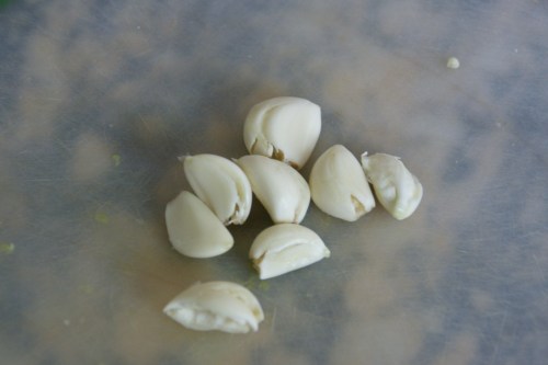 Smashing the garlic releases a substance that allows the peels to slip off easily!