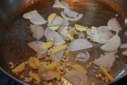 Same pot! Don't even bother to wipe it out-- just add a little bit of oil