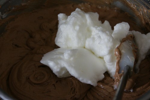 Fold the batter over the whites, turn bowl, fold over again.  Continue til whites are mixed in; it's ok if you see just a few streaks of white. DO NOT STIR!