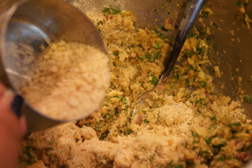 The crumbs absorb the moisture quickly, so add the crumbs a bit at a time, then stir well and check the consistency of the falafel