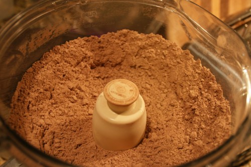 If there are little bits of chocolate chips floating around, that's fine.  They will melt in the hot liquid.