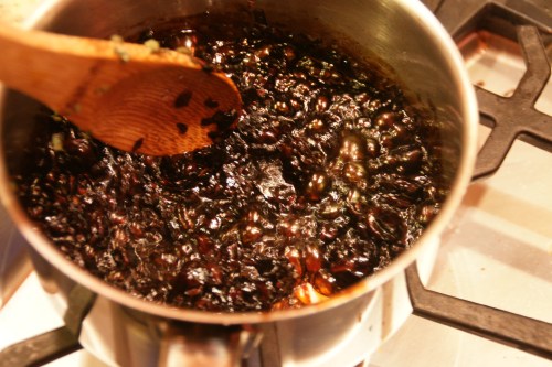 The liquid will be thickened, just binding together the cherries and shallots