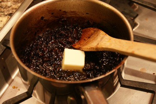 Butter is an enrichment and with the vinegar helps to create a thick sauce (think oil and vinegar emulsification).  So really stir hard!