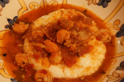 Creamy, cheesy grits and tender tails in a delicious tomato seafood sauce with just a bit of a kick!