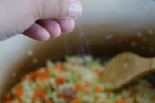 Just use a little salt to help break down the vegetables; the country ham has plenty of salt to season the soup!