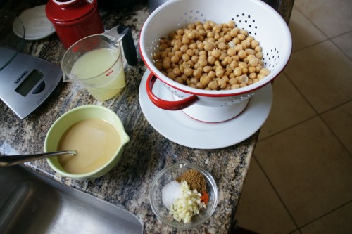 Mise en place: 1) lemon water, 2) tahini olive oil, 3) garlic and spices, 4) drained chickpies.